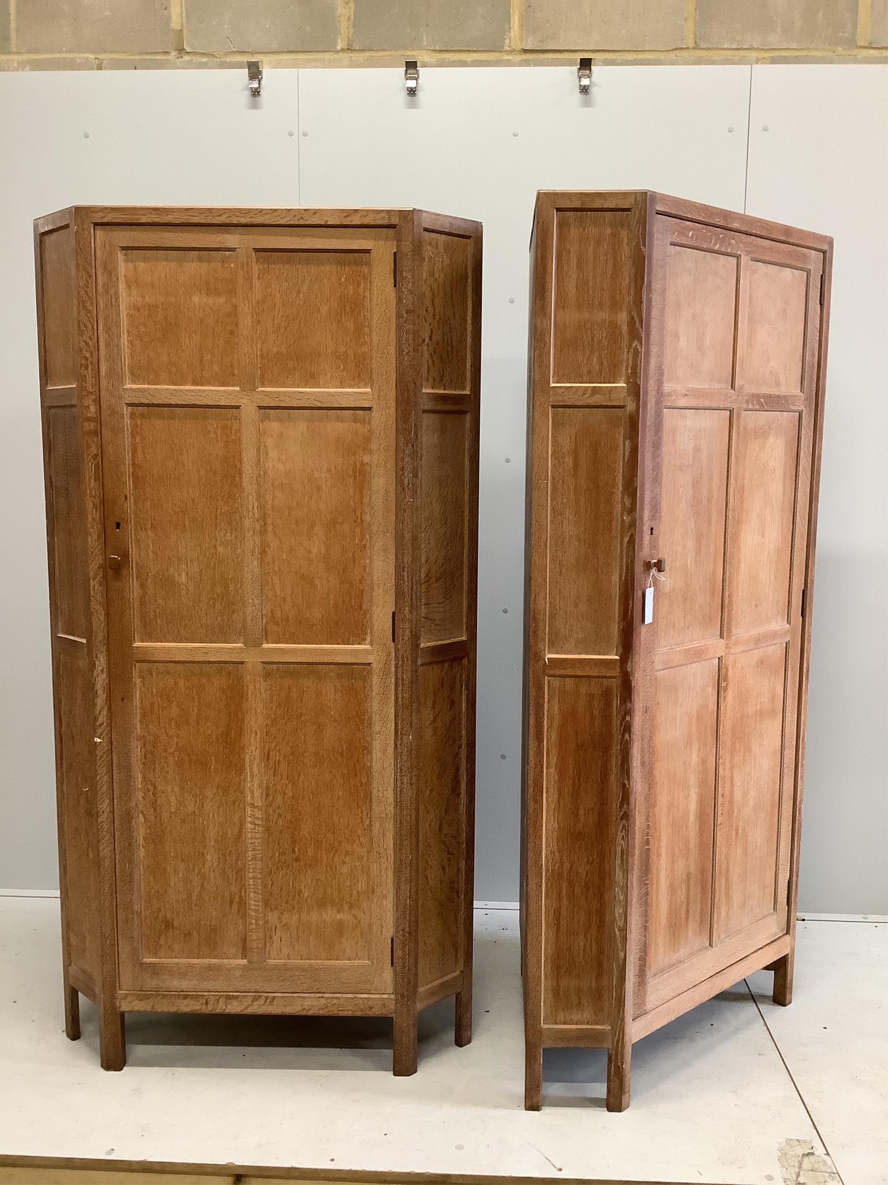 Heal & Son Ltd, a pair of bleached oak corner wardrobes, width 94cm, depth 53cm, height 182cm. Condition - fair to good